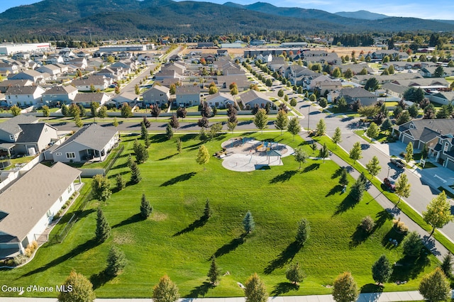 birds eye view of property with a mountain view