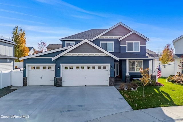 craftsman-style house with a garage and a front lawn