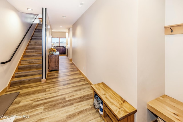 hallway featuring wood-type flooring