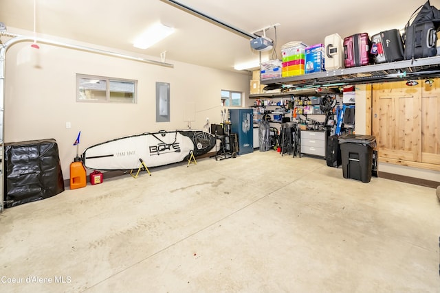 garage featuring electric panel and a garage door opener