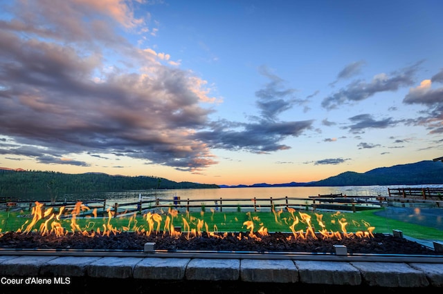 exterior space featuring a mountain view and a dock