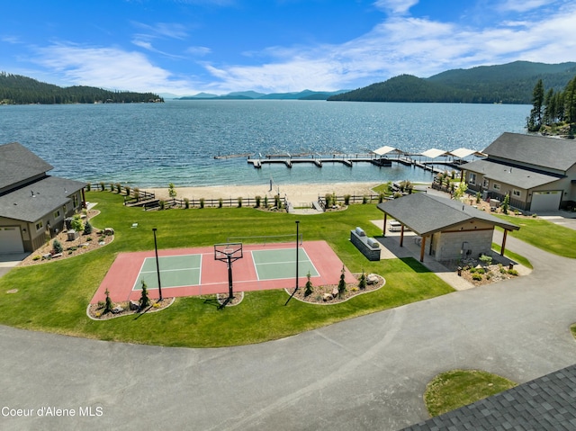 birds eye view of property featuring a water and mountain view