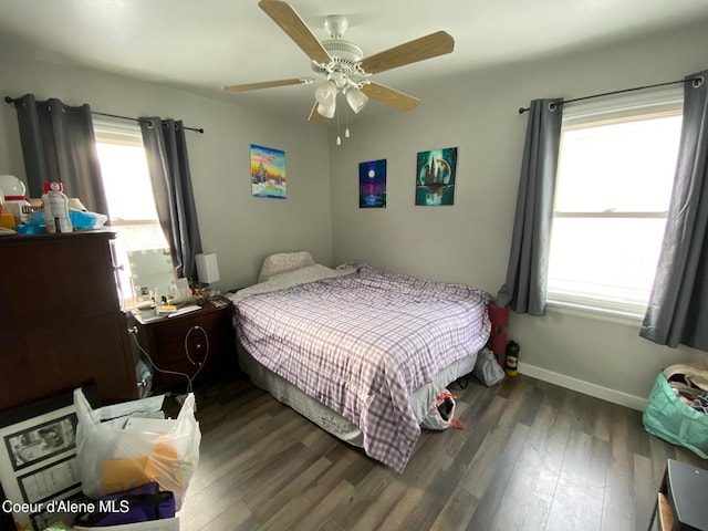 bedroom with ceiling fan and dark hardwood / wood-style floors