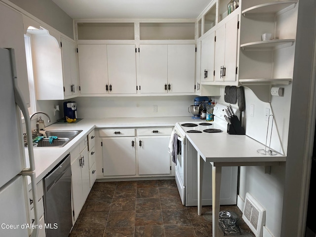 kitchen featuring white cabinetry, sink, and white appliances