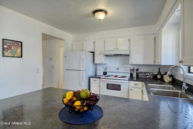 kitchen featuring white appliances, sink, a textured ceiling, white cabinetry, and kitchen peninsula