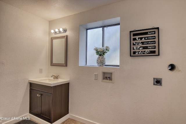 bathroom with vanity and a textured ceiling