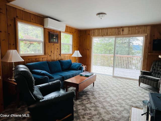 living room featuring a wall unit AC, wood walls, and carpet flooring