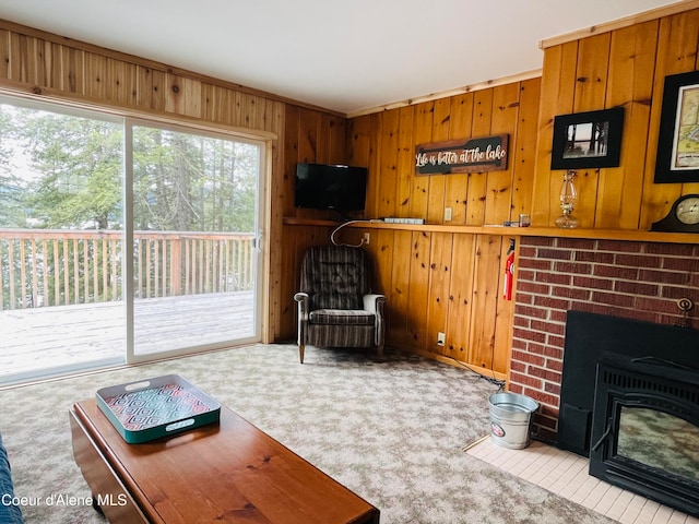 living room with wooden walls and light carpet