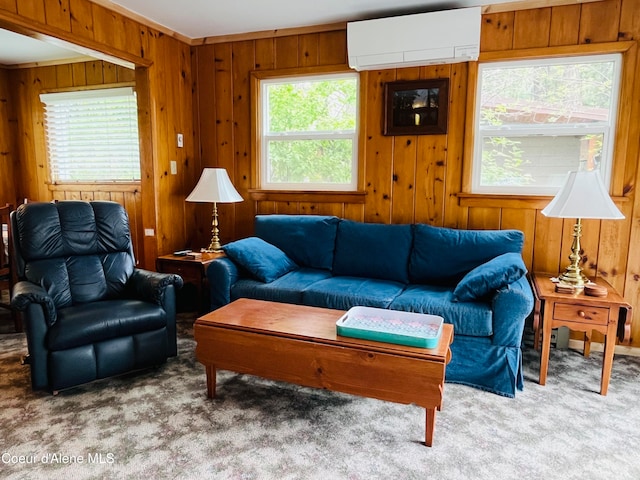 living room with carpet, an AC wall unit, and a wealth of natural light