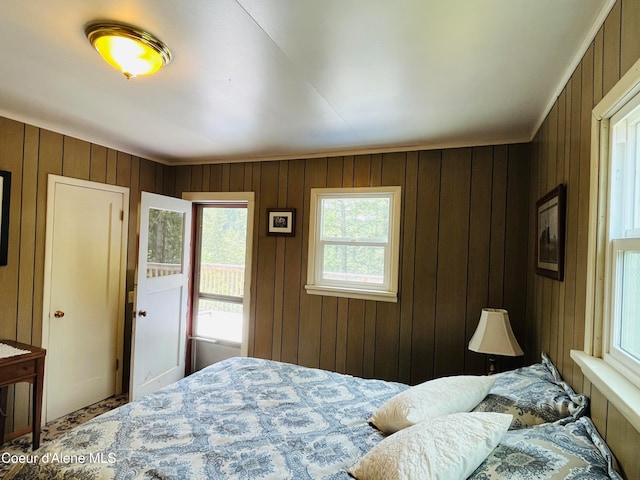 bedroom with wooden walls