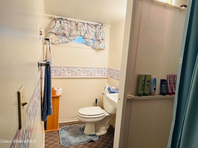 bathroom featuring toilet