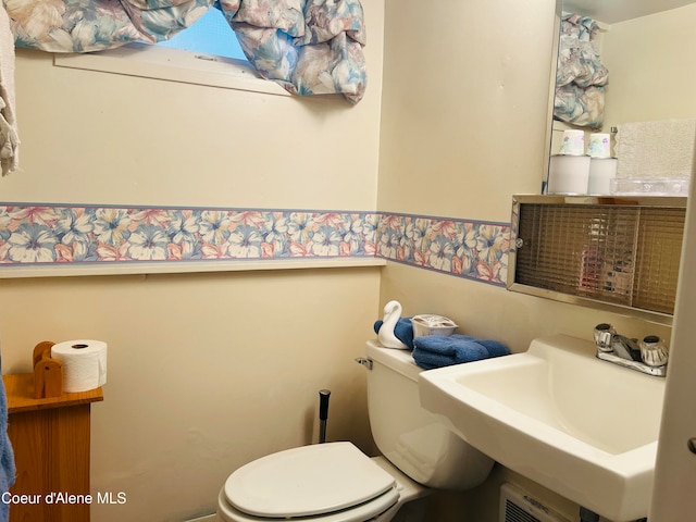 bathroom featuring sink and toilet