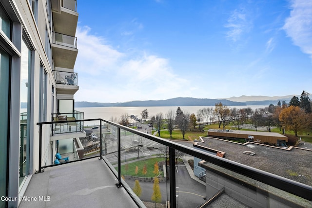 balcony with a water and mountain view