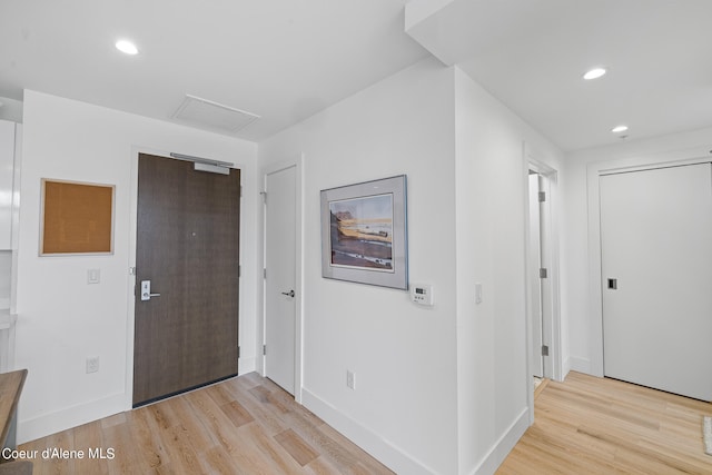 entryway with light hardwood / wood-style flooring