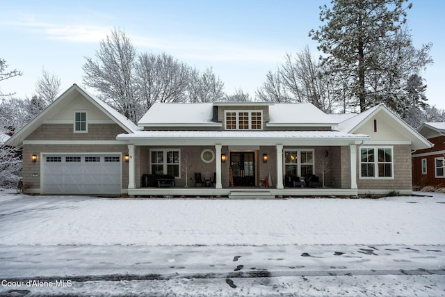 view of front of house with covered porch and a garage