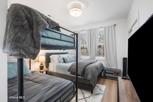 bedroom with light hardwood / wood-style flooring