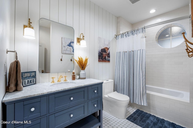 full bathroom featuring shower / bathtub combination with curtain, tile patterned flooring, vanity, and toilet