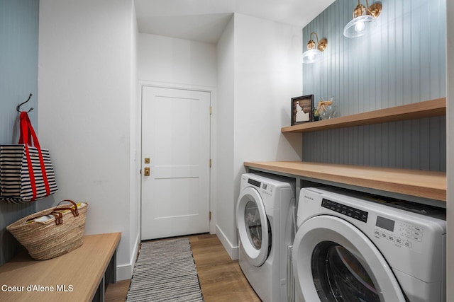 laundry area featuring dark wood-type flooring and washing machine and clothes dryer