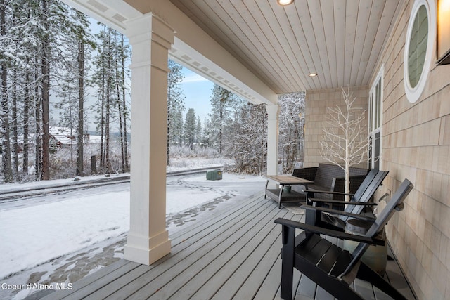 view of snow covered deck