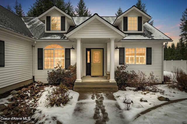 view of snow covered property entrance