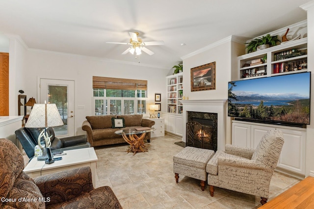 living room with a fireplace, light wood-type flooring, ceiling fan, and ornamental molding