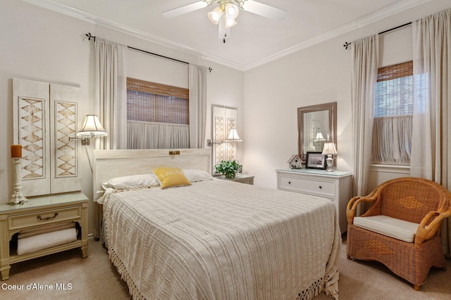 carpeted bedroom with ceiling fan and ornamental molding