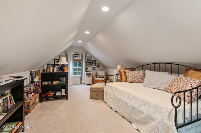 carpeted bedroom with vaulted ceiling