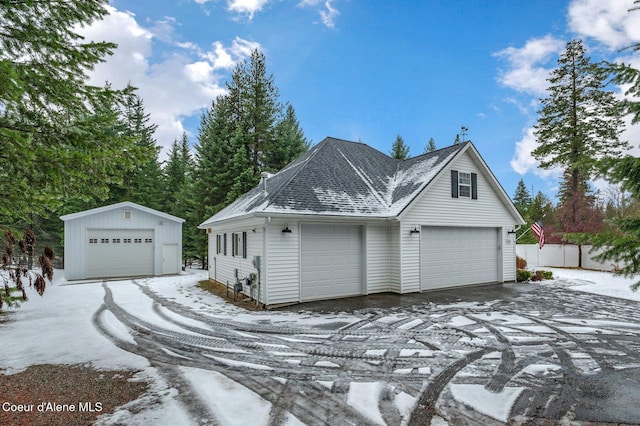 view of front of house featuring an outbuilding and a garage