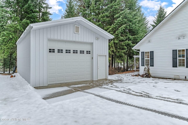 view of snow covered garage