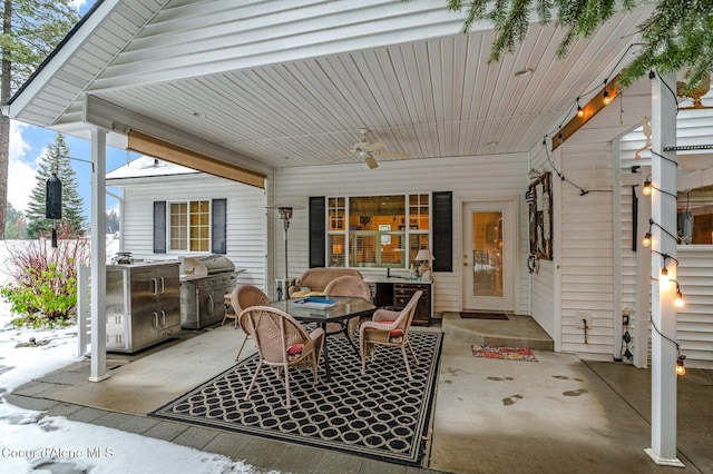 view of patio with ceiling fan, a grill, and area for grilling