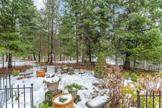 view of yard layered in snow