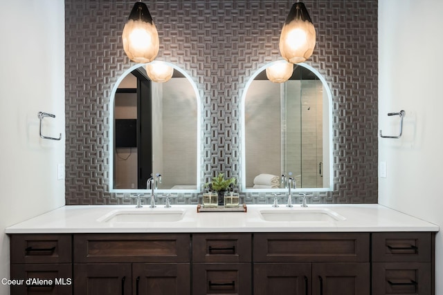 full bathroom featuring double vanity and a sink