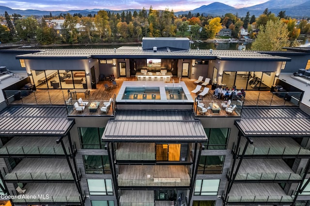 property at dusk featuring a mountain view
