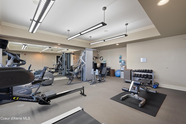 workout area featuring baseboards, crown molding, and recessed lighting