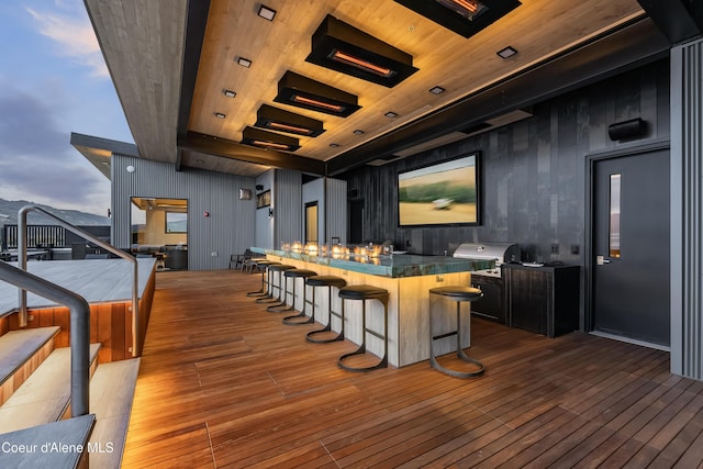 exterior space featuring area for grilling and outdoor wet bar