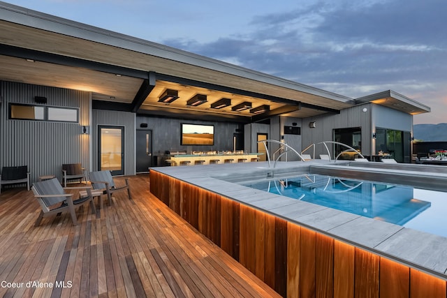 view of swimming pool featuring a wooden deck