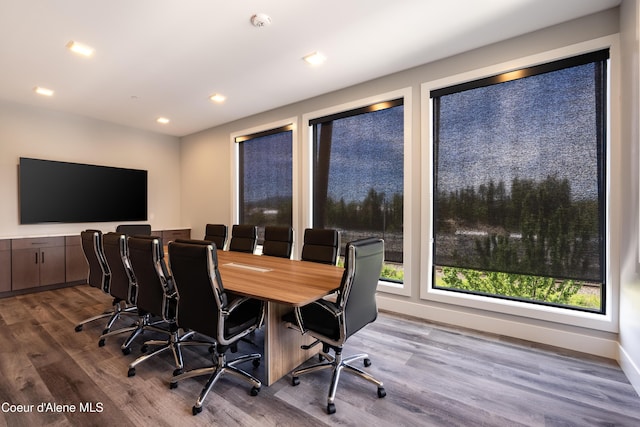 home office with baseboards, wood finished floors, and recessed lighting