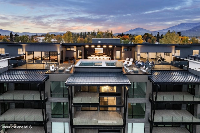 property at dusk featuring a mountain view