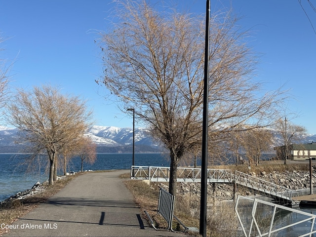view of street with a water and mountain view