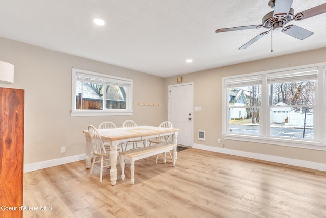 dining area featuring light hardwood / wood-style flooring and ceiling fan