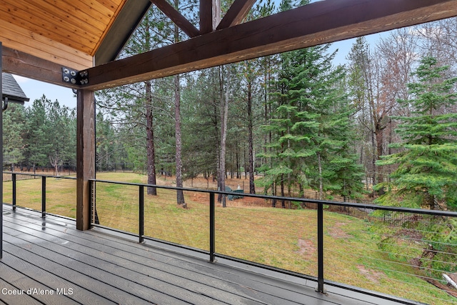 wooden terrace with a yard