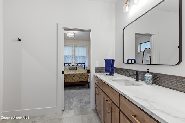 bathroom featuring tile patterned flooring and vanity