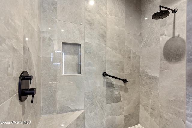 bathroom featuring a tile shower