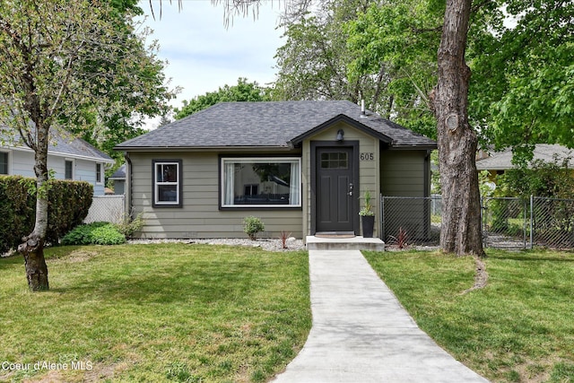 bungalow-style house with a front yard