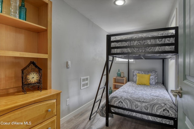 bedroom featuring hardwood / wood-style flooring