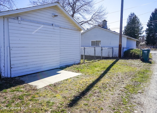 view of side of home with an outdoor structure