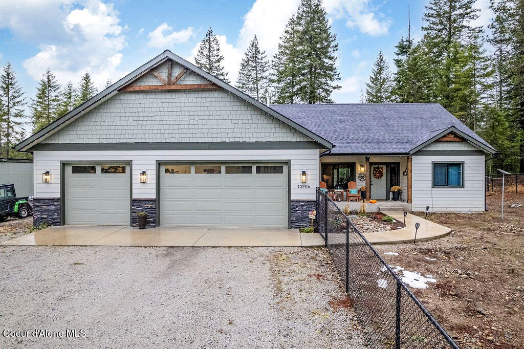 view of front of home with a garage and covered porch