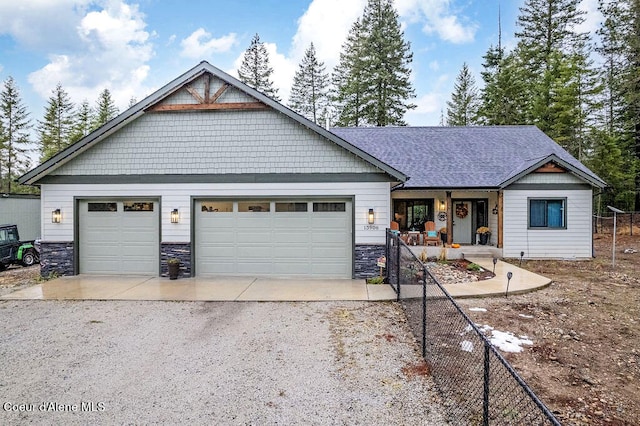 view of front of home with a garage and covered porch