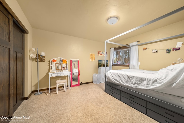 bedroom with light colored carpet