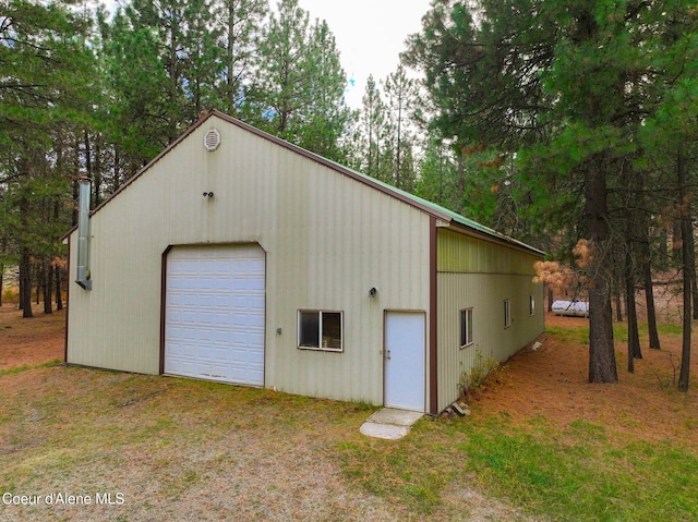 694 S Signal Point Rd, Post Falls, ID 83854 - detached garage with view of wooded area